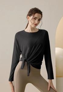 Detail of modal sports long sleeve top with hem tie-up design for yoga and fitness training