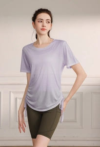 Detail of light purple yoga t-shirt with side drawstring and breathable fabric