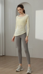 Detail of slim-fit jacquard yoga top with breathable texture and asymmetric hemline
