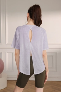 Detailed back view of light purple yoga top with stylish slit and breathable hollow out design