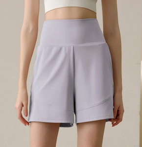 Detail view of high-waist light purple nylon sports shorts with curved stitching design