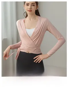 Pink wrap yoga cardigan detail with waist tie and professional breathable athletic fabric