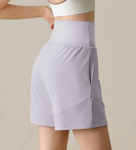 Detail of high-waist light purple yoga shorts showing seam design and lifting effect