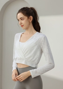 White wrap crop top yoga shirt with long sleeves and cross front detail for fitness