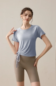 Detail view of light blue yoga t-shirt with adjustable side drawstring for fitness
