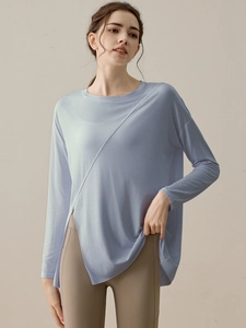 Loose light blue long sleeve yoga top with side slits and modern split seam design