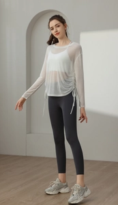 Detail of white semi-transparent yoga cover-up with adjustable side drawstrings