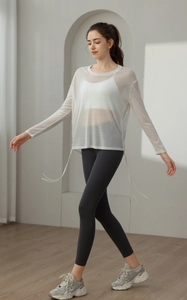 Macro detail of breathable white mesh yoga cover-up with stylish side drawstring ties