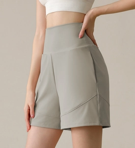Detailed view of high-waist yoga shorts with slimming tummy control and decorative seams