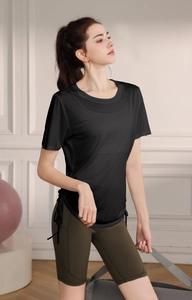 Detail view of black t-shirt with side drawstring adjustment and olive green shorts