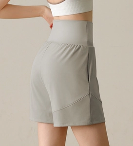 Detail view of high waist athletic shorts with side pockets and slimming stitching