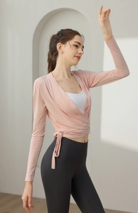 Detail of light pink slim fit yoga cardigan with side tie-up and deep V-neck wrap design