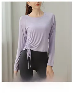 Detail of the side drawstring ruching and soft purple fabric on this yoga top
