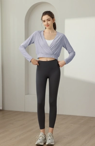 Detail of lavender wrap yoga top and grey high waist leggings for fitness and pilates