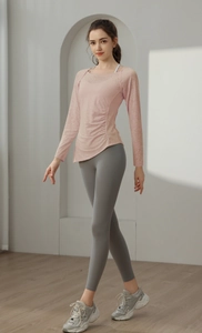 Detailed side view of pink jacquard yoga top with breathable fabric and side ruching design