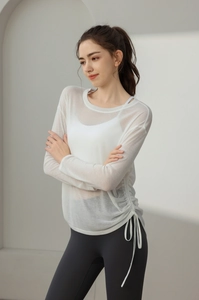 Macro shot of breathable semi-transparent white sports top with adjustable side drawstrings