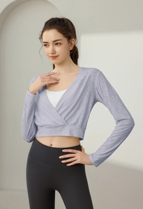Detail of light purple wrap gym top with V-neckline and textured nylon fabric for yoga