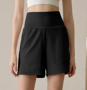 Close-up of black high-waisted nylon sports shorts with slimming wide waistband