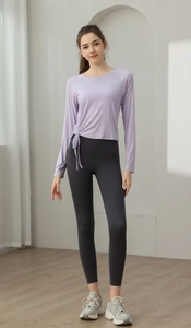 Detail of lavender yoga top featuring adjustable side drawstring and breathable fabric