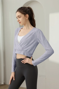 Detail of light purple wrap-around yoga top with fine textured fabric and V-neckline
