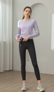 Close-up of lilac slim-fit yoga top with side drawstring details and ruched texture