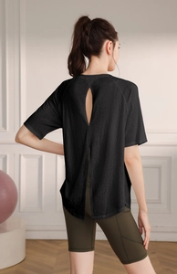 Rear view detail of black yoga top with a stylish vertical slit for extra breathability
