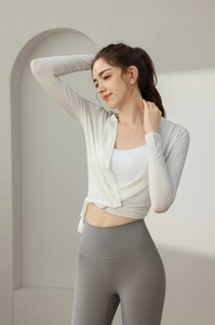 Detail of white wrap-around yoga cardigan with breathable athletic fabric and slimming fit