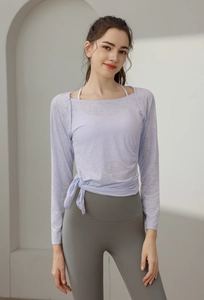 Light purple long sleeve yoga top featuring side drawstring detail and textured fabric