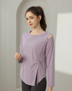 Detail of lavender yoga top featuring cold shoulder cut and side drawstring with split hem