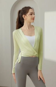 Detail of light green yoga wrap cardigan with side tie design and cross-over front