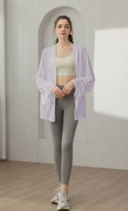 Detail of lavender yoga jacket with semi-transparent fabric and gathered cuffs for women