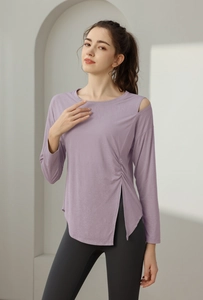 Detail of lavender jacquard yoga top featuring off-shoulder cut and side slit design