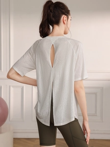 Lightweight breathable yoga top with split back design and sheer knit fabric in grey