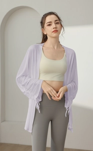 Detail of lavender sheer yoga cover-up with drawstring cuffs and breathable fabric