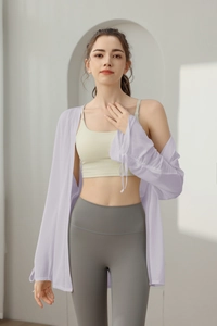 Detail of lavender sheer yoga cover-up with drawstring sleeves on a female model