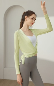 Detail of avocado green wrap-style yoga cardigan with slim fit and side tie design