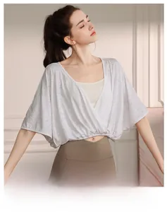 Detail of the white jacquard texture on this loose batwing sleeve yoga cover-up top