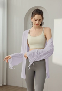 Detail of light purple yoga cover-up showing breathable fabric and drawstring cuffs