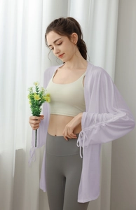 Detail view of light purple sun-protective yoga cardigan with drawstring cuffs and mesh fabric