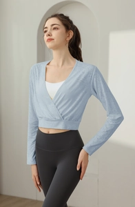 Detail view of light blue nylon jacquard crop top with cross V-neck for yoga