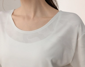 Close-up of white camo burnout fabric on crew neck athletic quick-dry fitness t-shirt