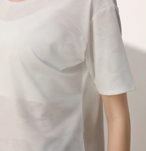 Detail of white camo burnout mesh fabric on lightweight quick-dry athletic t-shirt