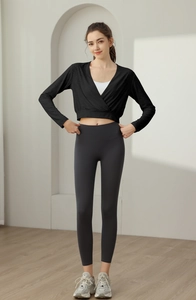 Detail of cross-wrap long sleeve yoga top with breathable jacquard nylon fabric