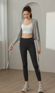 Three-piece yoga set with light grey cardigan, white sports vest, and black leggings