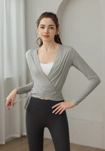 Detail view of a slim fit yoga wrap cardigan with side tie design and V-neckline
