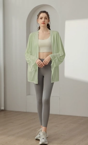 Detail of light green mesh sun protection yoga jacket with breathable long sleeves