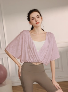 Detail of cross-wrap batwing sleeve yoga cover-up with breathable jacquard fabric