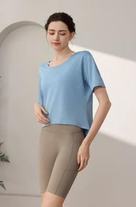 Close-up of women's camo burn-out dry fit tee with side slit and pocket yoga shorts