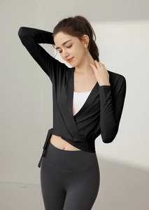 Detail of black cross-wrap yoga cardigan with tie-up waist and breathable long sleeves