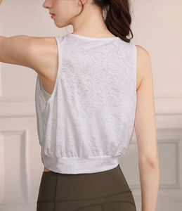Close-up back view of white jacquard knit yoga crop top with burnout textured fabric